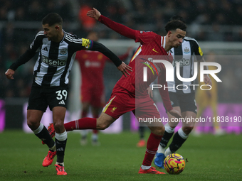 Liverpool's Curtis Jones breaks past Newcastle United's Bruno Guimaraes during the Premier League match between Newcastle United and Liverpo...