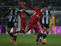 Liverpool's Curtis Jones breaks past Newcastle United's Bruno Guimaraes during the Premier League match between Newcastle United and Liverpo...