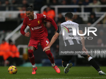 Liverpool's Darwin Nunez takes on Newcastle United's Fabian Schar during the Premier League match between Newcastle United and Liverpool at...