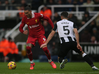 Liverpool's Darwin Nunez takes on Newcastle United's Fabian Schar during the Premier League match between Newcastle United and Liverpool at...