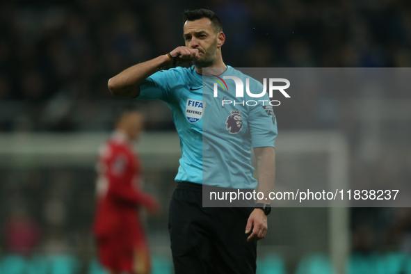 Referee Andy Madley officiates the Premier League match between Newcastle United and Liverpool at St. James's Park in Newcastle, United King...