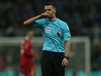 Referee Andy Madley officiates the Premier League match between Newcastle United and Liverpool at St. James's Park in Newcastle, United King...