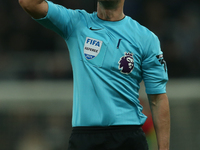 Referee Andy Madley officiates the Premier League match between Newcastle United and Liverpool at St. James's Park in Newcastle, United King...