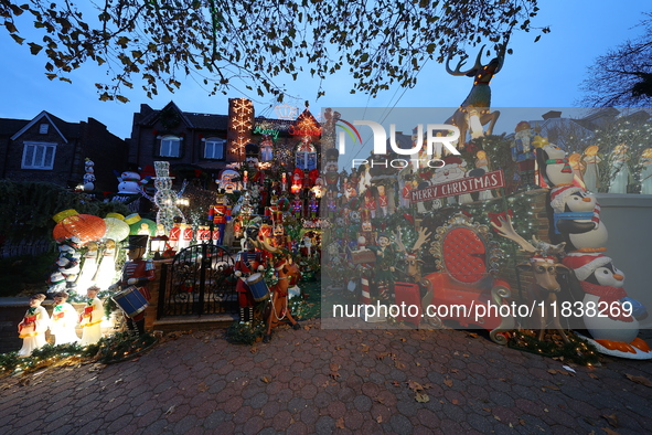 Holiday lights and inflatable characters stand in the front yard of a home in the Dyker Heights section of Brooklyn, N.Y., on December 4, 20...