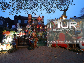 Holiday lights and inflatable characters stand in the front yard of a home in the Dyker Heights section of Brooklyn, N.Y., on December 4, 20...