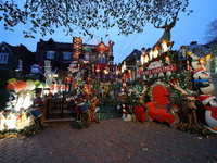 Holiday lights and inflatable characters stand in the front yard of a home in the Dyker Heights section of Brooklyn, N.Y., on December 4, 20...