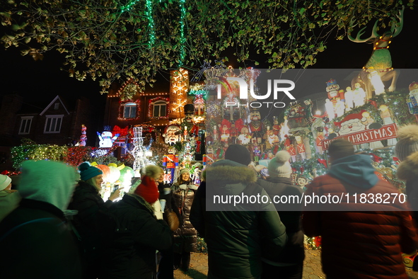 Holiday lights and inflatable characters stand in the front yard of a home in the Dyker Heights section of Brooklyn, N.Y., on December 4, 20...