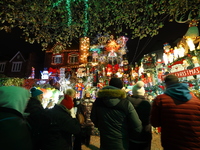 Holiday lights and inflatable characters stand in the front yard of a home in the Dyker Heights section of Brooklyn, N.Y., on December 4, 20...