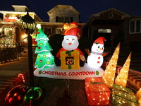 Holiday lights and inflatable characters stand in the front yard of a home in the Dyker Heights section of Brooklyn, N.Y., on December 4, 20...