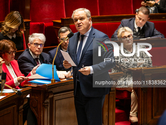 Francois-Noel Buffet, Minister attached to the Prime Minister responsible for Overseas France, speaks during the questions to the government...