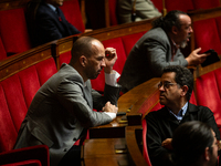 Manuel Bompard (L) and Gabriel Amard (R), deputies of the La France Insoumise - Nouveau Front Populaire group, are seen during the questions...