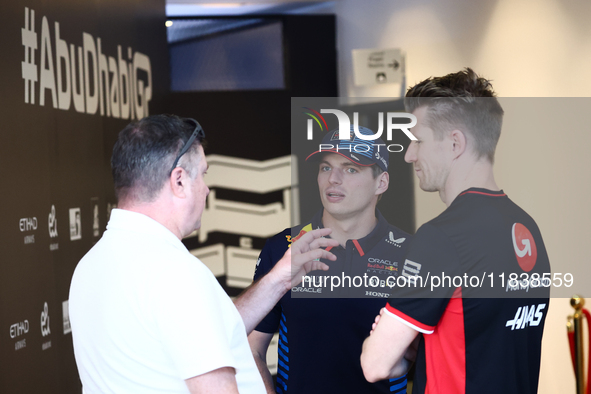 Max Verstappen of Red Bull Racing and Nico Hulkenberg of Haas ahead of the Formula 1 Abu Dhabi Grand Prix at Yas Marina Circuit in Abu Dhabi...