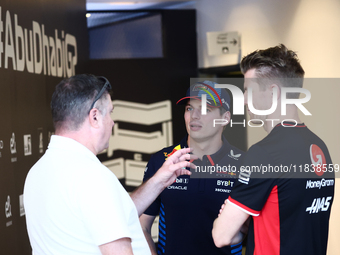 Max Verstappen of Red Bull Racing and Nico Hulkenberg of Haas ahead of the Formula 1 Abu Dhabi Grand Prix at Yas Marina Circuit in Abu Dhabi...