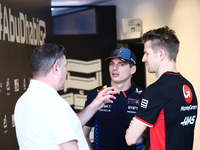 Max Verstappen of Red Bull Racing and Nico Hulkenberg of Haas ahead of the Formula 1 Abu Dhabi Grand Prix at Yas Marina Circuit in Abu Dhabi...