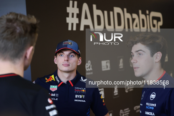 Max Verstappen of Red Bull Racing and Franco Colapinto of Williams ahead of the Formula 1 Abu Dhabi Grand Prix at Yas Marina Circuit in Abu...