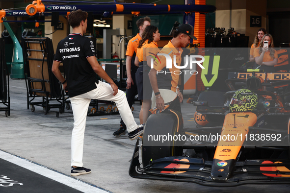 George Russell of Mercedes and Lando Norris of McLaren ahead of the Formula 1 Abu Dhabi Grand Prix at Yas Marina Circuit in Abu Dhabi, Unite...