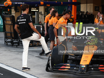 George Russell of Mercedes and Lando Norris of McLaren ahead of the Formula 1 Abu Dhabi Grand Prix at Yas Marina Circuit in Abu Dhabi, Unite...