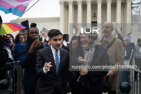 Demonstrations outside the Supreme Court as it hears a case on gender-affirming care for transgender children in Washington, DC, on December...