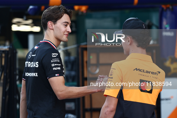 George Russell of Mercedes and Lando Norris of McLaren ahead of the Formula 1 Abu Dhabi Grand Prix at Yas Marina Circuit in Abu Dhabi, Unite...