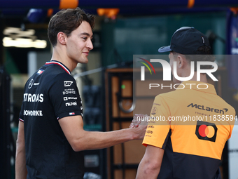 George Russell of Mercedes and Lando Norris of McLaren ahead of the Formula 1 Abu Dhabi Grand Prix at Yas Marina Circuit in Abu Dhabi, Unite...