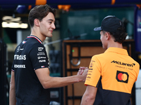 George Russell of Mercedes and Lando Norris of McLaren ahead of the Formula 1 Abu Dhabi Grand Prix at Yas Marina Circuit in Abu Dhabi, Unite...