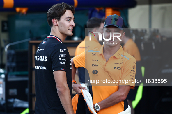 George Russell of Mercedes and Lando Norris of McLaren ahead of the Formula 1 Abu Dhabi Grand Prix at Yas Marina Circuit in Abu Dhabi, Unite...