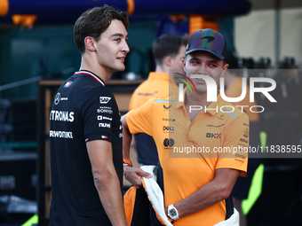 George Russell of Mercedes and Lando Norris of McLaren ahead of the Formula 1 Abu Dhabi Grand Prix at Yas Marina Circuit in Abu Dhabi, Unite...