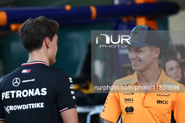 George Russell of Mercedes and Lando Norris of McLaren ahead of the Formula 1 Abu Dhabi Grand Prix at Yas Marina Circuit in Abu Dhabi, Unite...