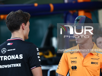 George Russell of Mercedes and Lando Norris of McLaren ahead of the Formula 1 Abu Dhabi Grand Prix at Yas Marina Circuit in Abu Dhabi, Unite...