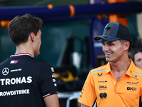 George Russell of Mercedes and Lando Norris of McLaren ahead of the Formula 1 Abu Dhabi Grand Prix at Yas Marina Circuit in Abu Dhabi, Unite...