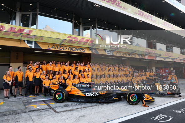 McLaren team members pose for a photo ahead of the Formula 1 Abu Dhabi Grand Prix at Yas Marina Circuit in Abu Dhabi, United Arab Emirates o...