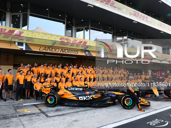 McLaren team members pose for a photo ahead of the Formula 1 Abu Dhabi Grand Prix at Yas Marina Circuit in Abu Dhabi, United Arab Emirates o...