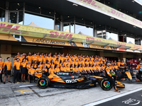 McLaren team members pose for a photo ahead of the Formula 1 Abu Dhabi Grand Prix at Yas Marina Circuit in Abu Dhabi, United Arab Emirates o...