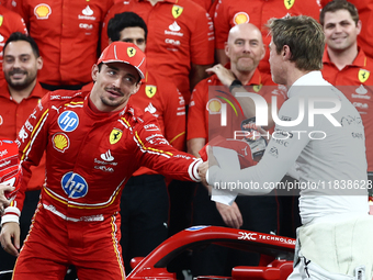 Charles Leclerc of Ferrari and Brad Pitt ahead of the Formula 1 Abu Dhabi Grand Prix at Yas Marina Circuit in Abu Dhabi, United Arab Emirate...