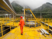 Workers carry out routine inspections on the facilities and equipment of the Ferriichong phosphate mine in Hualuo Village, Sanjia Street, Zh...