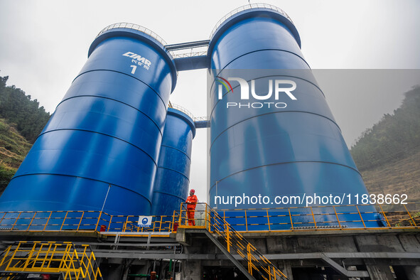 Workers carry out routine inspections on the facilities and equipment of the Ferriichong phosphate mine in Hualuo Village, Sanjia Street, Zh...