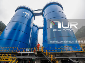 Workers carry out routine inspections on the facilities and equipment of the Ferriichong phosphate mine in Hualuo Village, Sanjia Street, Zh...