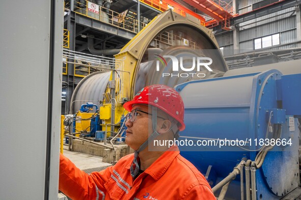 Workers carry out routine inspections on the facilities and equipment of the Ferriichong phosphate mine in Hualuo Village, Sanjia Street, Zh...