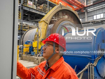 Workers carry out routine inspections on the facilities and equipment of the Ferriichong phosphate mine in Hualuo Village, Sanjia Street, Zh...