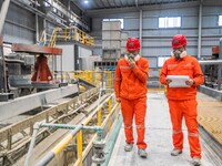 Workers carry out routine inspections on the facilities and equipment of the Ferriichong phosphate mine in Hualuo Village, Sanjia Street, Zh...