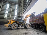 Workers load phosphate ore products at the plant of the Ferriichong phosphorus mine in Hualuo village, Sanjia street, Zhijin County, in Biji...