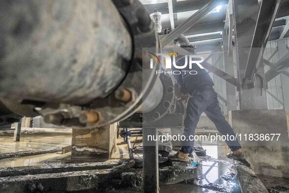 Workers carry out routine inspections on the facilities and equipment of the Ferriichong phosphate mine in Hualuo Village, Sanjia Street, Zh...