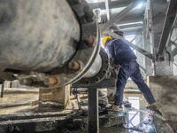 Workers carry out routine inspections on the facilities and equipment of the Ferriichong phosphate mine in Hualuo Village, Sanjia Street, Zh...