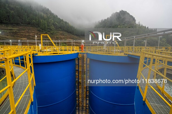 Workers carry out routine inspections on the facilities and equipment of the Ferriichong phosphate mine in Hualuo Village, Sanjia Street, Zh...