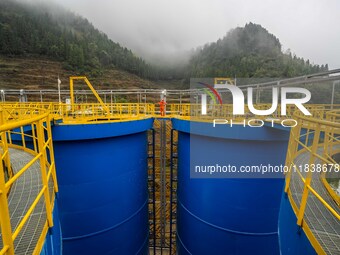 Workers carry out routine inspections on the facilities and equipment of the Ferriichong phosphate mine in Hualuo Village, Sanjia Street, Zh...