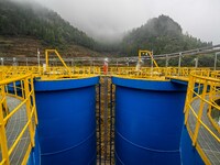 Workers carry out routine inspections on the facilities and equipment of the Ferriichong phosphate mine in Hualuo Village, Sanjia Street, Zh...