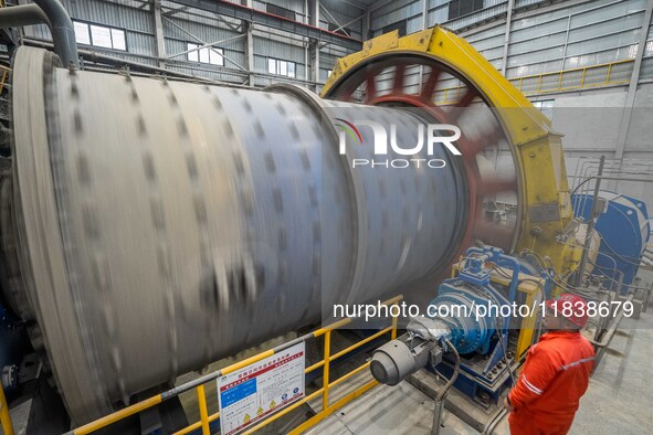 Workers carry out routine inspections on the facilities and equipment of the Ferriichong phosphate mine in Hualuo Village, Sanjia Street, Zh...