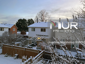 Snow covers houses following the first snowfall of the season in Toronto, Ontario, Canada, on December 5, 2024. (