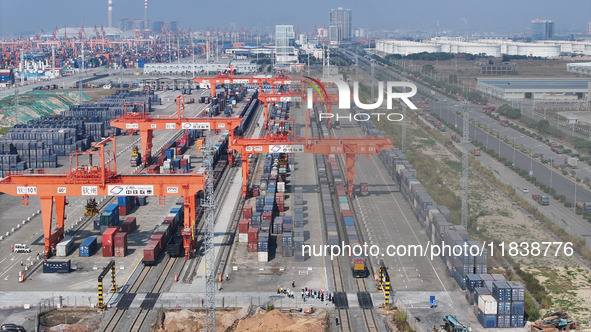 The X9578 Western Land-Sea New Channel rail and sea combined transport train departs from Qinzhou Railway Container Center station in Qinzho...