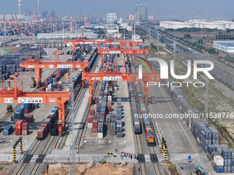 The X9578 Western Land-Sea New Channel rail and sea combined transport train departs from Qinzhou Railway Container Center station in Qinzho...